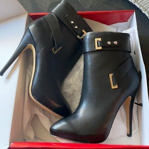 Guess Black Ankle Boots with Gold Accents. Run like a size 8